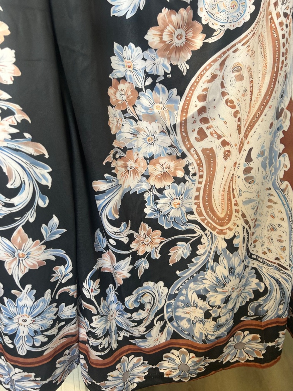 Black skirt elastic waist black with light blue tan, and white flowers